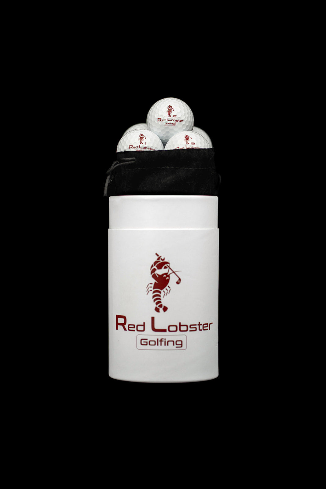 Geöffnete Lobbie Röhre mit schwarzem Samtbeutel und Golfbällen von Red Lobster Golfing