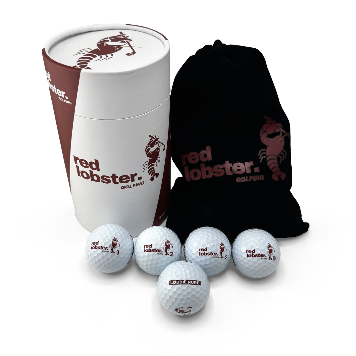 Lobbie PURE 12er von Red Lobster Golfing: weiße Geschenk-Tube, schwarzes Samtsäckchen und fünf weiße Golfbälle mit den Nummern 1, 2, 3 und 9 und dem Stempel „LOBBIE PURE“