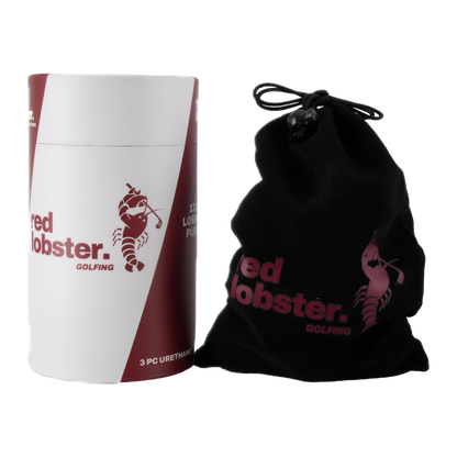 Lobbie PURE Dutzend-Zylinder mit Aufdruck „3 PC Urethane“ neben schwarzem Samtbeutel mit Red Lobster Golfing Logo